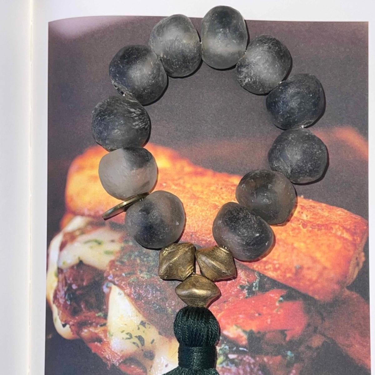 Studio Julia Atlas - Ice grey recycled glass Ghana, bronze, cotton tassel - mini