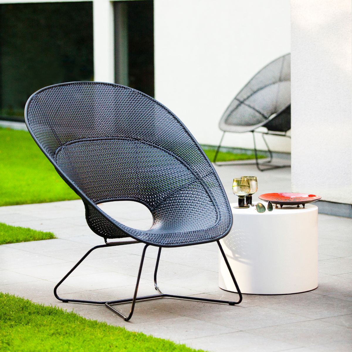Feelgood designs Tornaux lounge & footstool zwarte frame/rattan peel outdoor